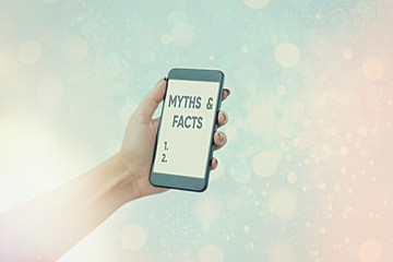 Writing note showing Myths And Facts. Business concept for usually traditional story of ostensibly...