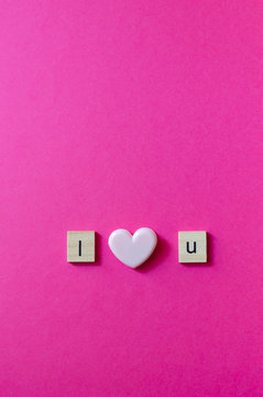 I Love You Text on pink background, flat lay