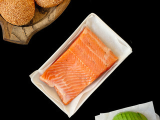 salmon steak on black background