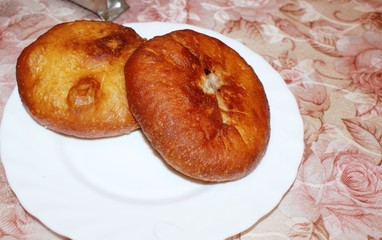 2 belyasha on a plate on the table