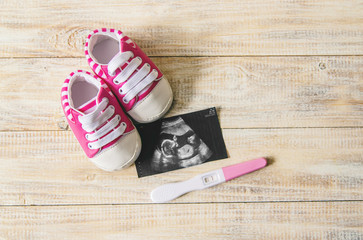 Ultrasound picture of a baby's photograph and accessories. Selective focus.