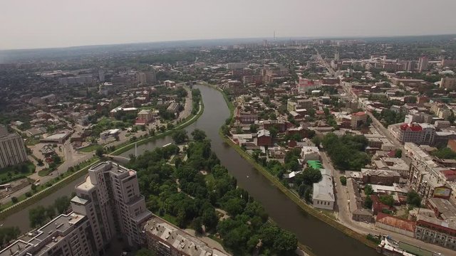 Aerial panorama of Kharkov city from above. Downtown or city center with famous historic buildings and green trees. Kharkov and Lopan rivers. Strelka park