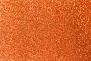 Orange glitter shiny texture background for christmas, Celebration concept.
