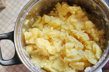 Boiled potatoes in a metal pan