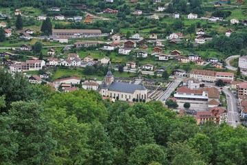 Fototapeta na wymiar Close-up view over La Bresse with focus on the church and cemetery