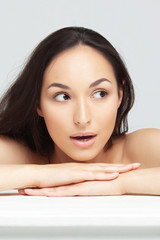 Obraz premium Portrait of young beautiful woman with clean perfect skin