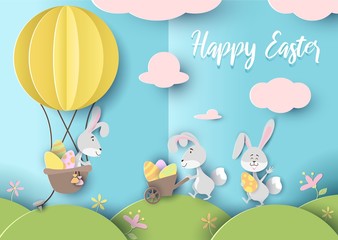 Happy easter greeting card in paper art style vector illustration. Banner with cute rabbits holding eggs on sunny meadow flat design. Spring holiday concept