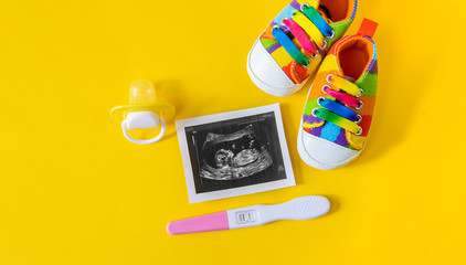 Ultrasound picture of a baby's photograph and accessories. Selective focus.