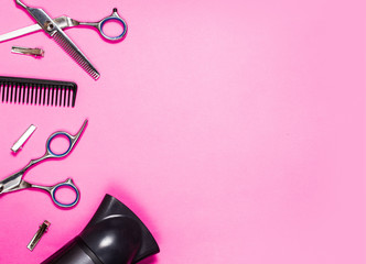 hairdressing accessories on a pink background look from above, mock up, nobody