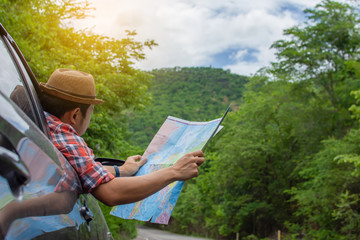 Tourists parking, open the map, check driving directions