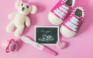 Ultrasound picture of a baby's photograph and accessories. Selective focus.