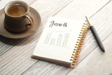 financial diagram on notepad at office table 