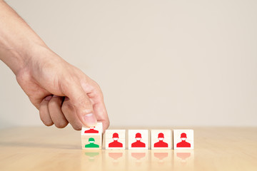 Asian man's hand flip wooden block recovering or cure people after covid concept of quarantine during coronavirus outbreak, social distance, self isolation on wood table or desk and white background.