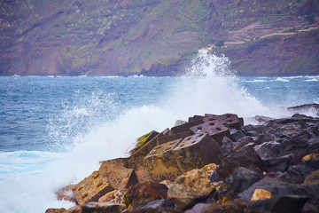Tenerife, Canary islands, Spain - view of the beautiful Atlantic ocean coast with volcanic rocks and stones