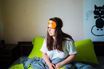 A tired and sleepy girl woke up early in the morning to work and did not get enough sleep, with a...