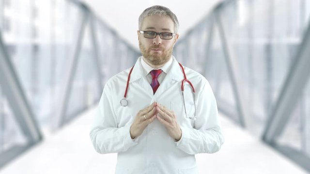 Doctor spreads his hands in a hospital hallway