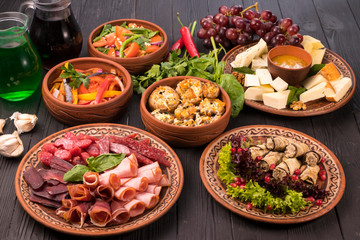Hospitable Georgian cuisine. Set with delicious food on ethnic plates