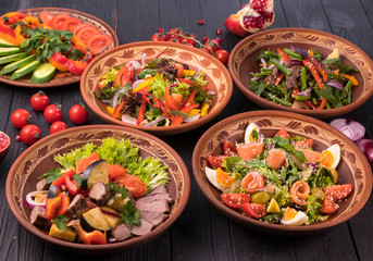 Hospitable Georgian cuisine. Set with delicious food on ethnic plates