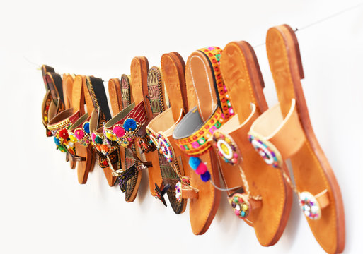 Indian Kolhapuri Ladies Chappal Hanging in Shop - Handmade Ethnic Footwear - Selective Focus