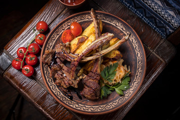 Hospitable Georgian cuisine. Grilled veal ribs with vegetables
