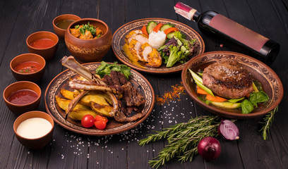 Hospitable Georgian cuisine. Set with delicious food on ethnic plates