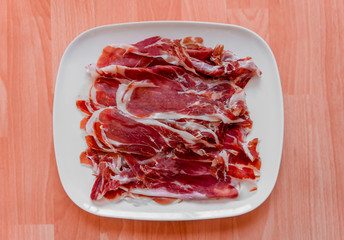 iberian ham in white plate