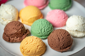 assorted scoopes of ice cream on plate