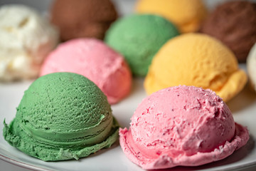 assorted scoopes of ice cream on plate