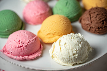 assorted scoopes of ice cream on plate