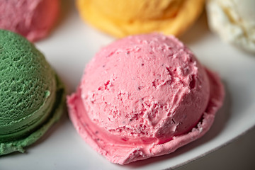close up of strawberry ice cream scoop