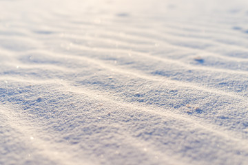 White sands dunes national monument low angle ground level view closeup of sand texture in New Mexico with pattern of lines waves
