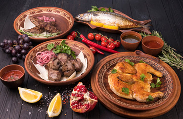 Hospitable Georgian cuisine. Set with delicious food on ethnic plates