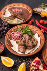 Fototapeta na wymiar Grilled meat on pita with pickled onions and herbs
