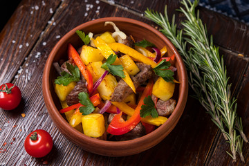 Hospitable Georgian cuisine. Warm salad with meat