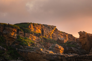 Sunset in the basque coast under Jaizkibel mountain in Hondarribia, Basque Country.