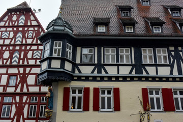 Traditional half-timbered houses on narrow medieval street in Rothenburg ob der Tauber, Bavaria, Germany. November 2014