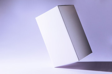 White box packaging template, isolated on purple background.