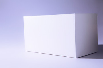 Closeup of white rectangular box. Mockup design.