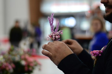 Hand Arranging Flower At school