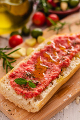 rustic bread, tomato and olive oil ready to make toasts