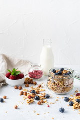 Healthy breakfast set on grey background. The concept of delicious and healthy food. Top view, copy space.