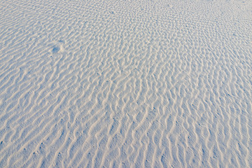 White sands dunes national monument gypsum sand with abstract ripple rippled pattern with footprint in La Luz, New Mexico USA in America