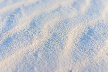 Macro abstract closeup of sand in White sands dunes national monument in New Mexico showing surface pattern and ripples texture at sunset