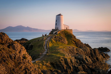 Tŵr Mawr Lighthouse, Llanddwyn Island, Anglesey in the dramatic landscapes of scenic Wales, fantastic adventure travel destination or holiday vacation to view picturesque scenery at sunrise or sunset