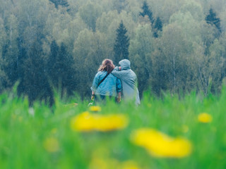 Fototapeta premium Two girls with a dog and a glass of wine near the spring forest. Morning in nature.