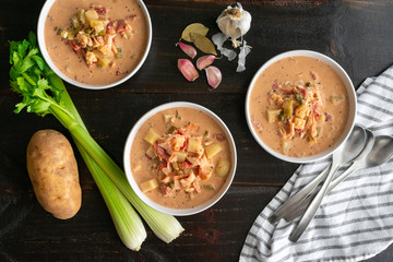 Smoked Salmon Chowder: Three bowls of chowder made with seafood and vegetables 