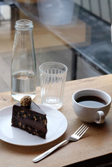 chocolate cake and coffee in a coffee shop