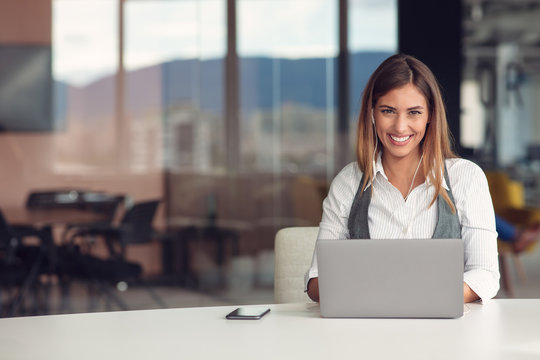 Modern Business Woman In The Office Working At Computer