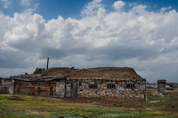 Kazakhstan. Residential house made of stone, clay and straw in the village of Toraigyr in the mountain natural Park Bayanaul.