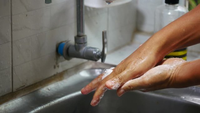 Hand washing with soap, Coronavirus (Covid-19) pandemic prevention outbreak. Rubbing nails, fingers,backhanded and wrist. Hygiene to stop spreading germs and bacteria. Health - cleanliness concept.